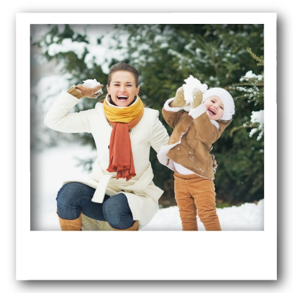 mom and child playing in snow