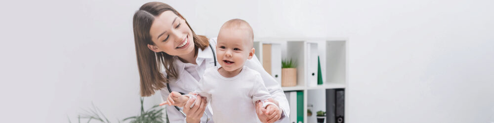 Father with daughter giving doctor a high-five