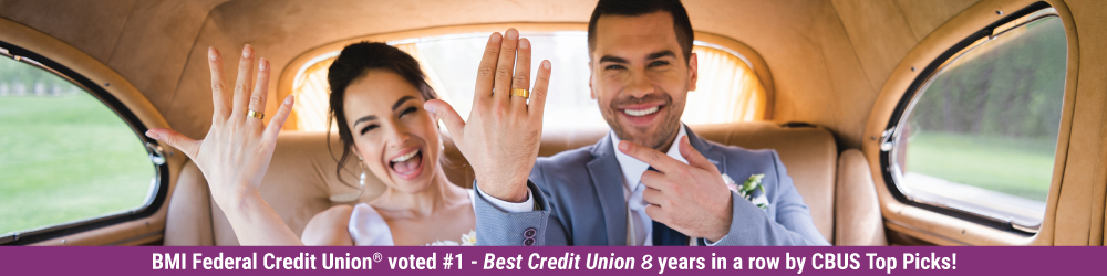 smiling couple just married in back seat of car