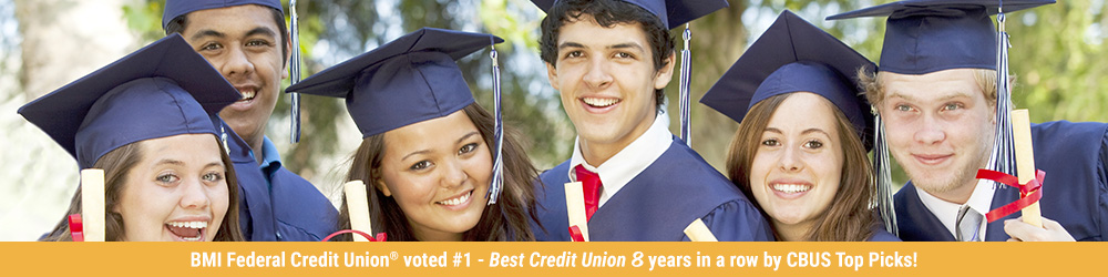 Graduates smiling with their diploma