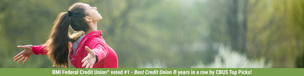 woman with arms stretched out in nature