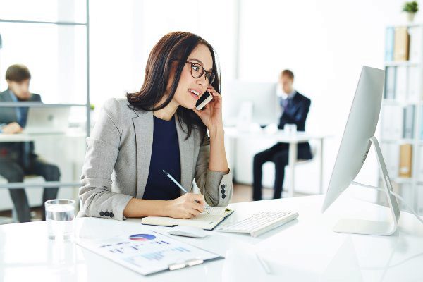 business woman on the phone in office space