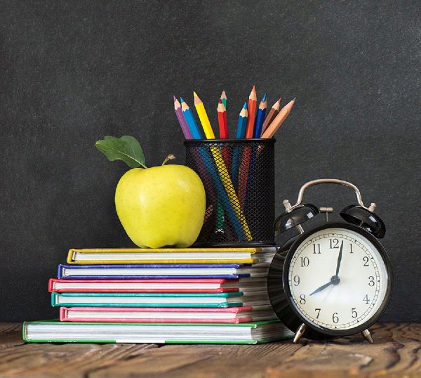 chalk board with school supplies
