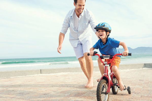 dad with son on a bike