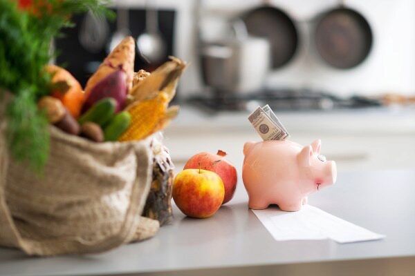 fall produce with a piggy bank