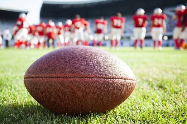 football team and ball on field