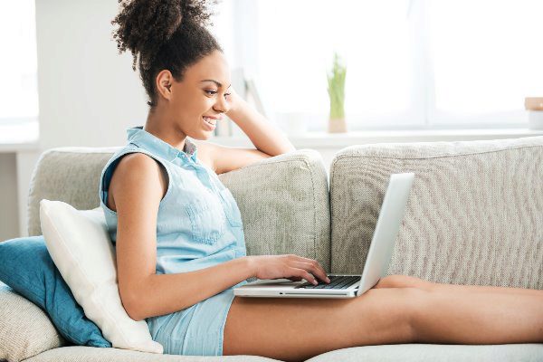 girl on computer smiling