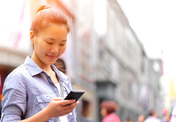 girl on mobile phone smiling