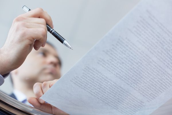 hand signing a contract