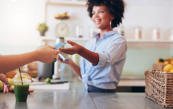 lady with ipad and credit card making purchase