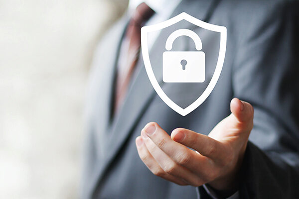 man in suit with shield icon