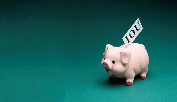 piggy bank and IOU tag