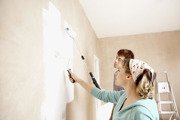 couple painting a room