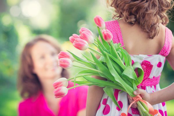 mother and daughter with flowers