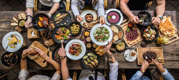 people eating barbecue food