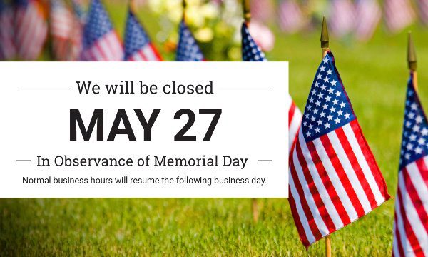sign for memorial day closure with american flags